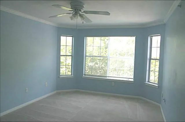 a view of an empty room with a window