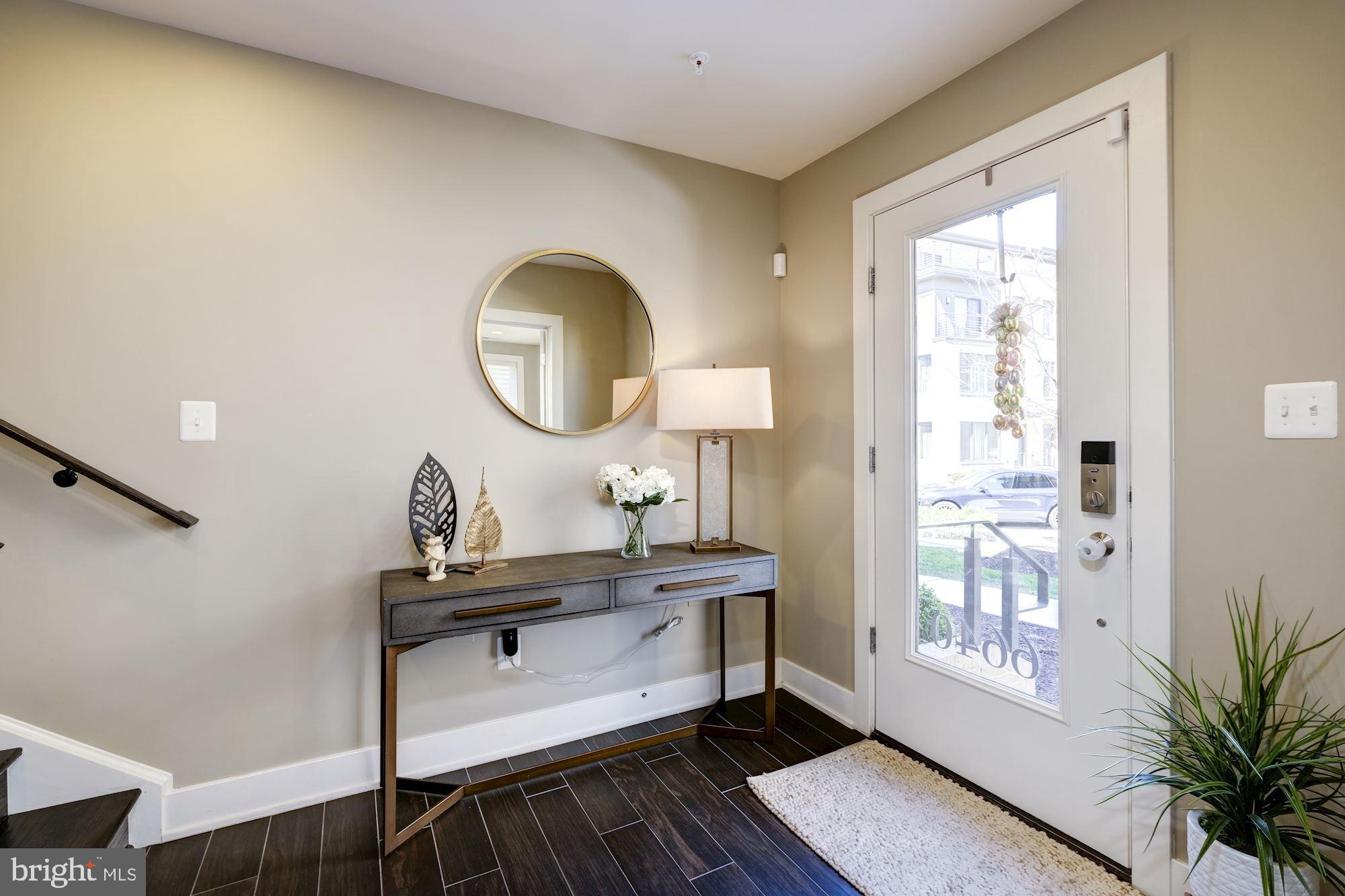 6640 Eames Way Bethesda, MD 20817 - Photo 2 of 38 a bathroom with a sink mirror and a window