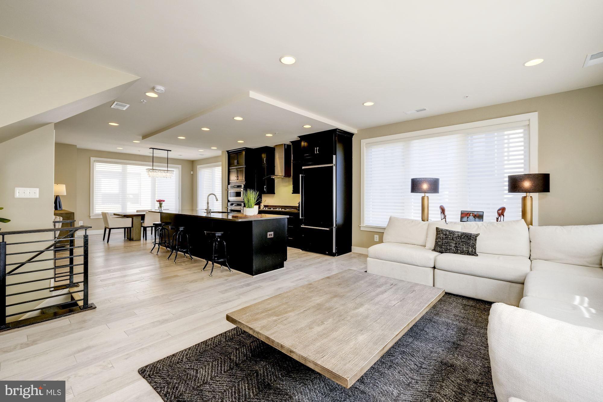 6640 Eames Way Bethesda, MD 20817 - Photo 11 of 38 a living room with furniture and kitchen view