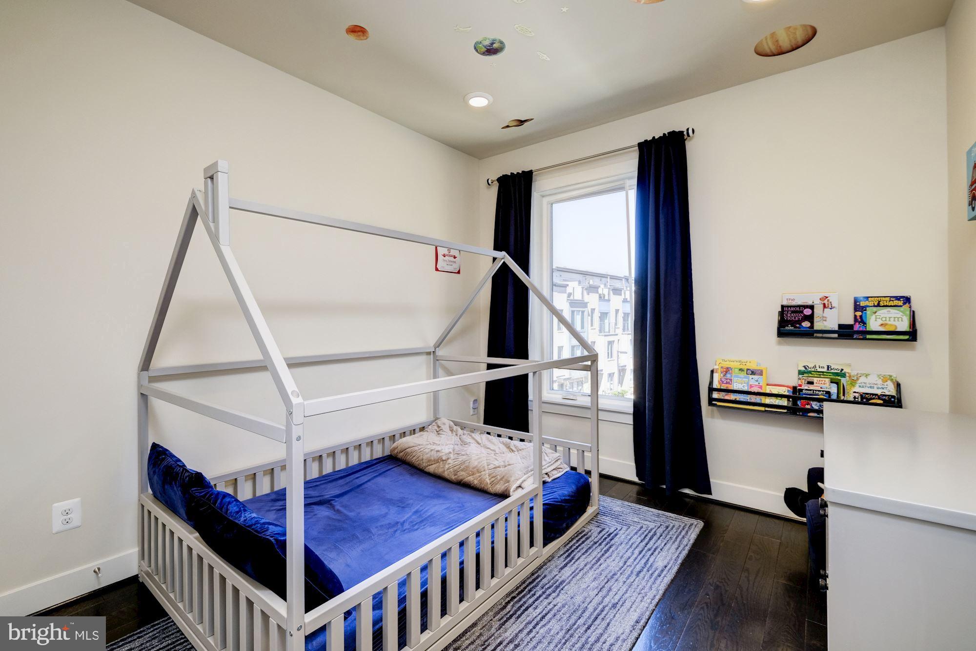 6640 Eames Way Bethesda, MD 20817 - Photo 22 of 38 a bedroom with furniture and a window