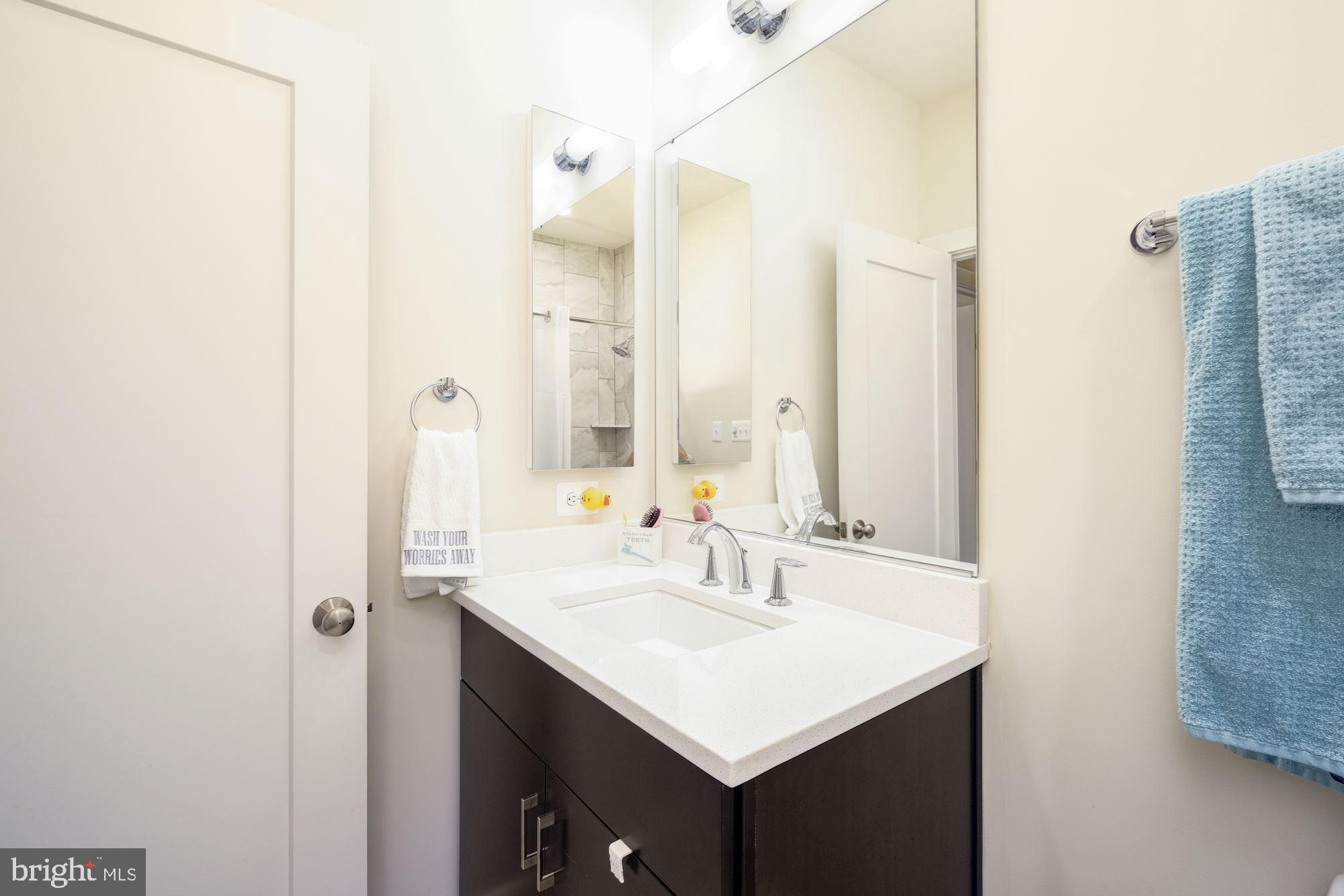 6640 Eames Way Bethesda, MD 20817 - Photo 24 of 38 a bathroom with a sink and a mirror