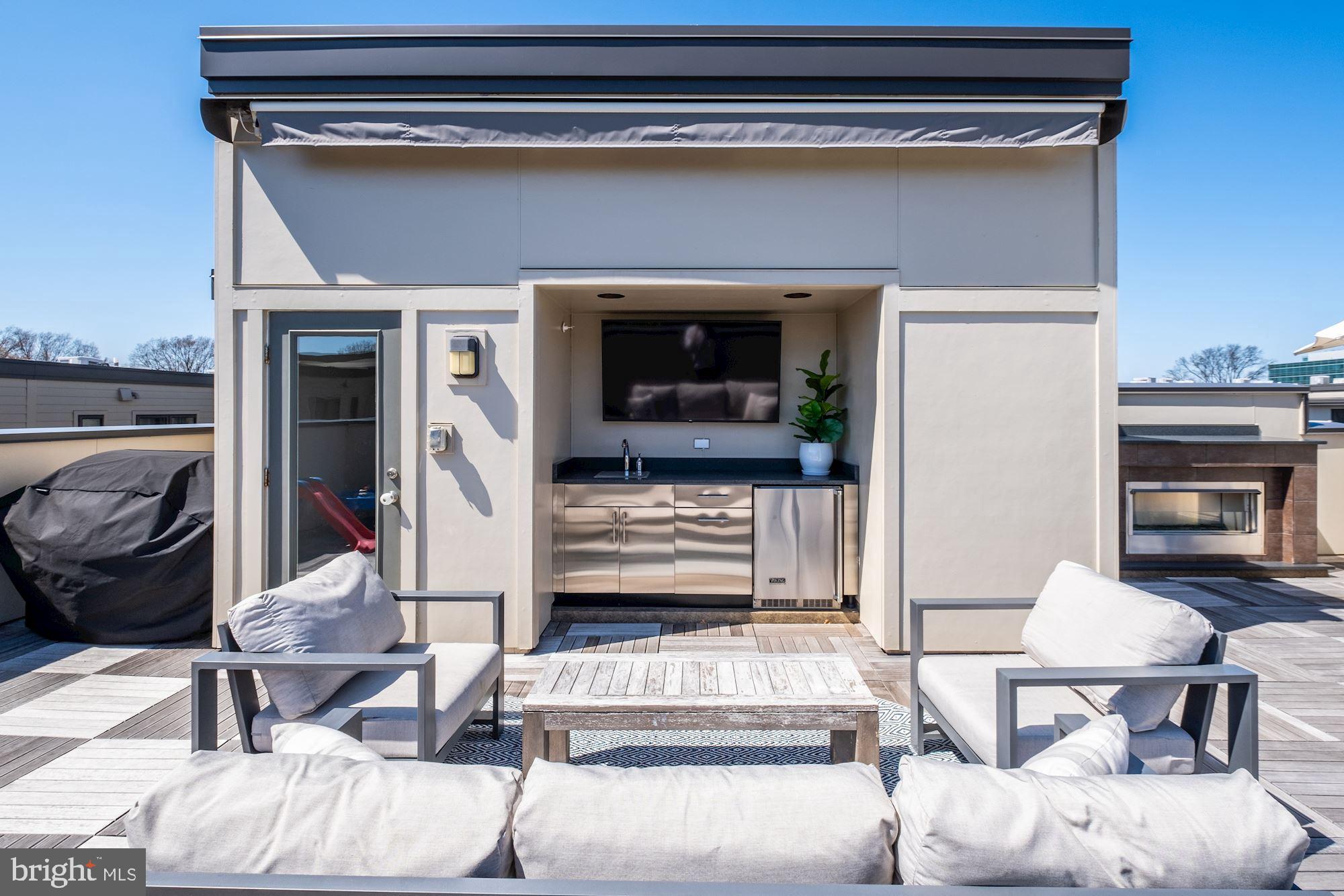 6640 Eames Way Bethesda, MD 20817 - Photo 26 of 38 a living room with furniture and a fireplace