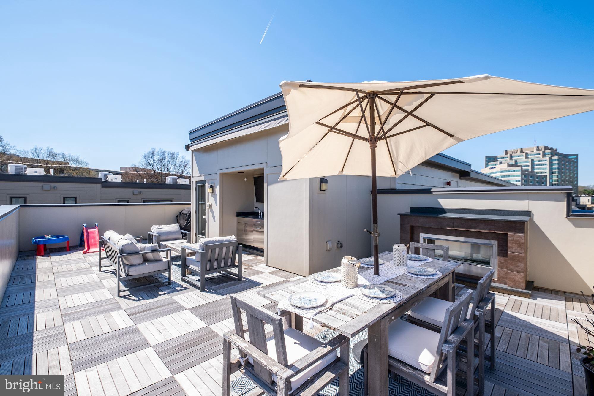 6640 Eames Way Bethesda, MD 20817 - Photo 27 of 38 a view of a table and chairs on the roof deck