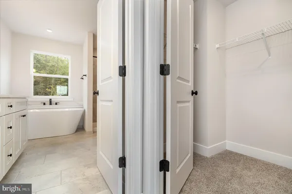 a white bath tub sitting in a bathroom