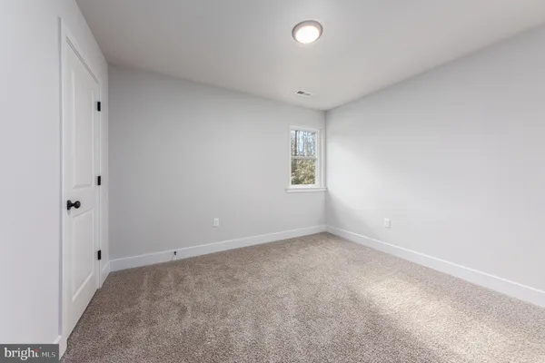 a view of a small space with racks on the wall