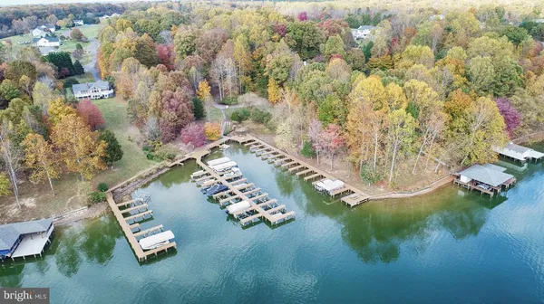 a view of a lake with houses in the back