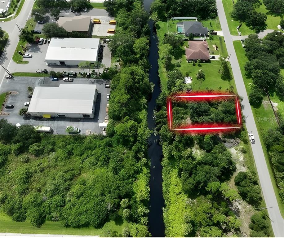 Oceanside St Port North Port, FL 34286 - Photo 2 of 10 an aerial view of a house with garden space and street view