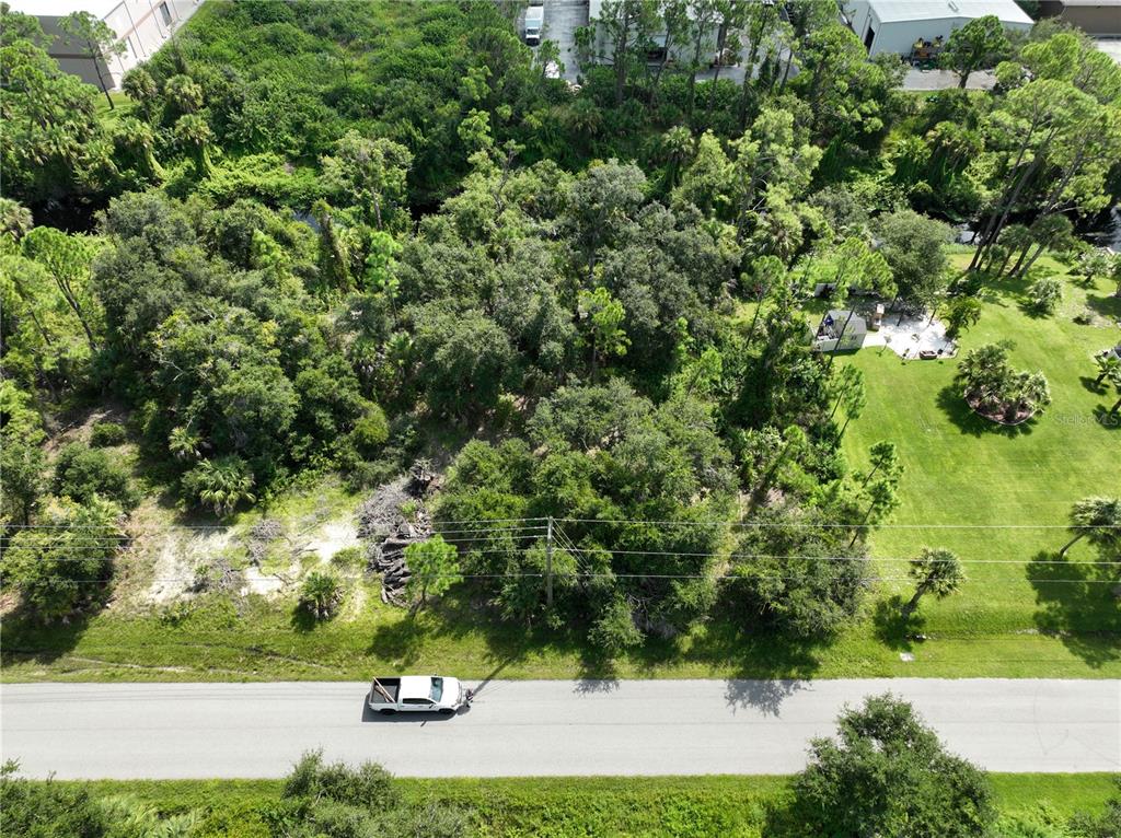 Oceanside St Port North Port, FL 34286 - Photo 4 of 10 an aerial view of a yard with houses
