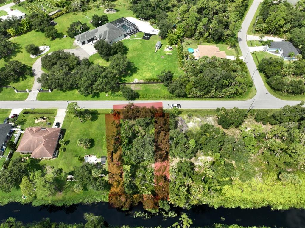Oceanside St Port North Port, FL 34286 - Photo 9 of 10 an aerial view of a garden with houses