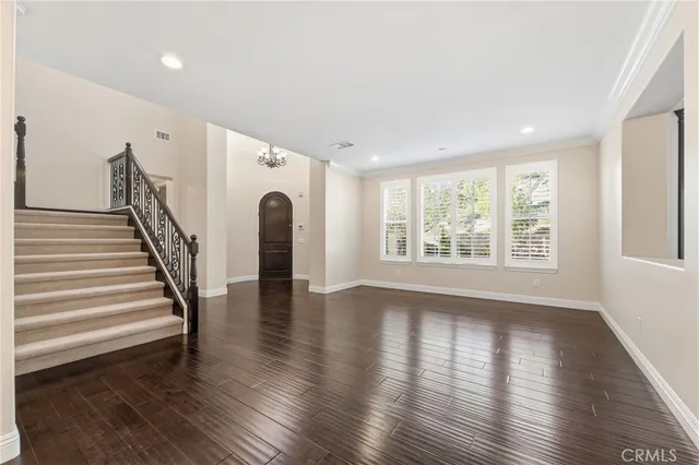 a view of an entryway with wooden floor and windows