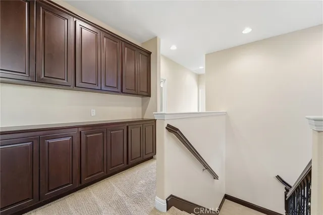 a kitchen with wooden cabinets and a sink