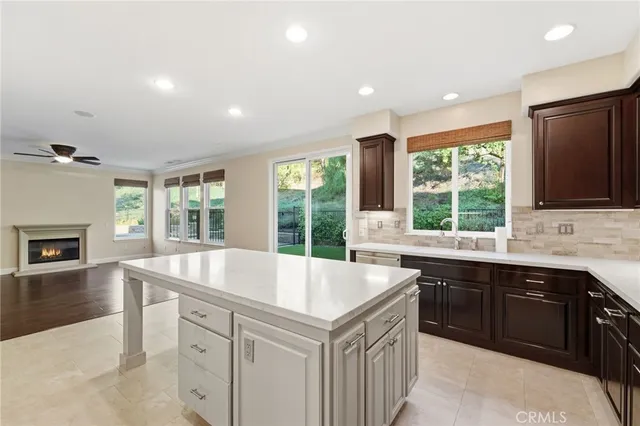 a kitchen with a sink and large window