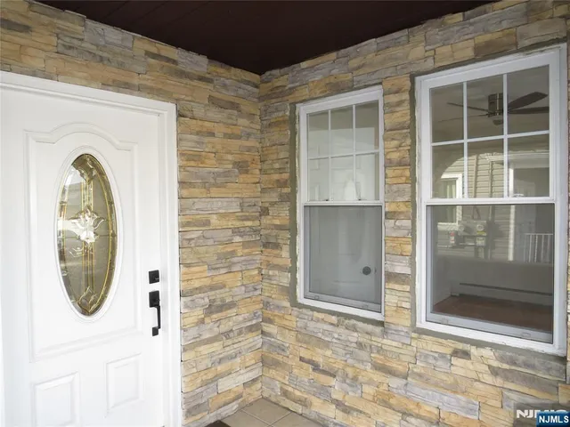 a front view of a house with a large window