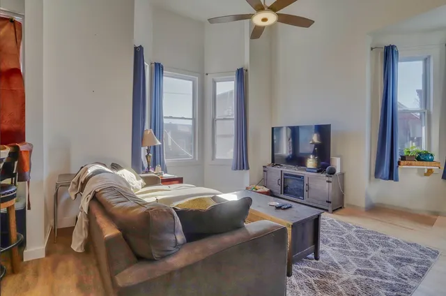 a bedroom with furniture and a window