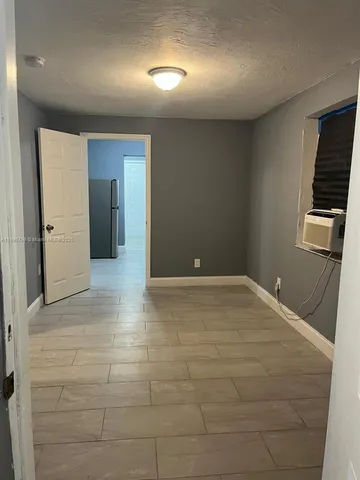 a view of a livingroom with wooden floor