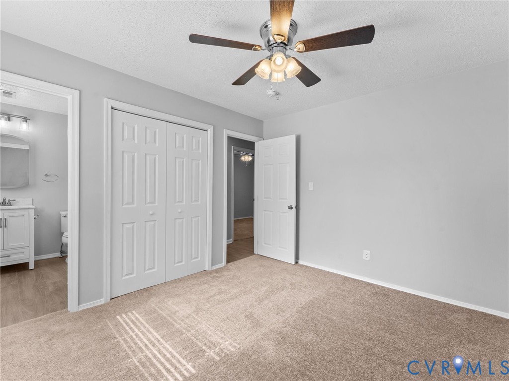 6927 Carsley Road Waverly, VA 23890 - Photo 28 of 51 Neutral-toned carpeting paired with light gray wal