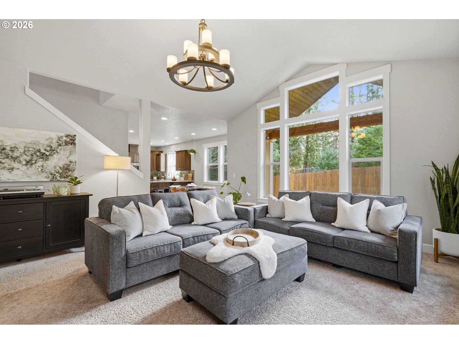 17390 Aubin Street Sandy, OR 97055 - Photo 11 of 41 a living room with furniture chandelier and a large window