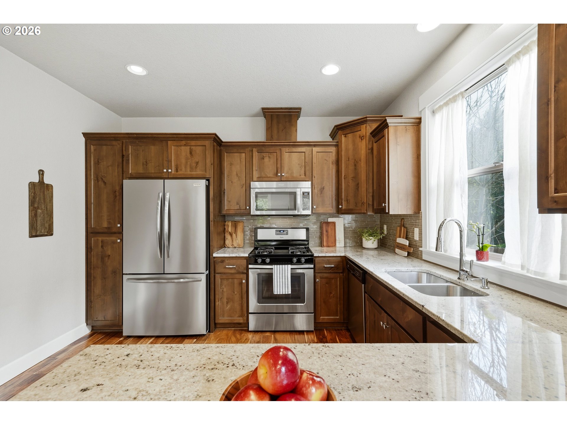 17390 Aubin Street Sandy, OR 97055 - Photo 19 of 41 a kitchen with granite countertop a refrigerator stove top oven and sink