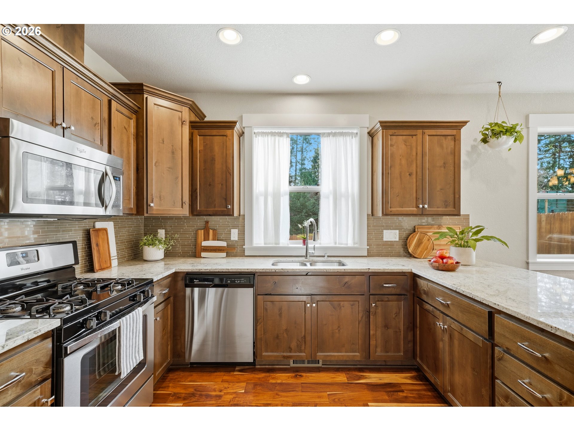 17390 Aubin Street Sandy, OR 97055 - Photo 20 of 41 a kitchen with stainless steel appliances granite countertop a sink stove and cabinets