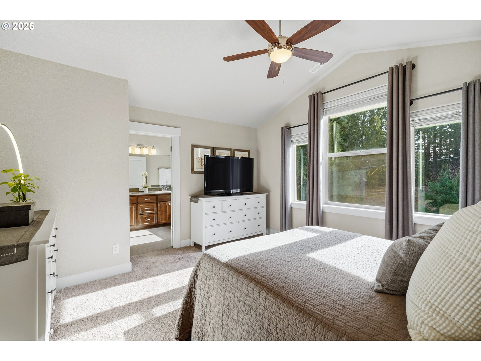 17390 Aubin Street Sandy, OR 97055 - Photo 26 of 41 a bedroom with a bed a window and a flat screen television