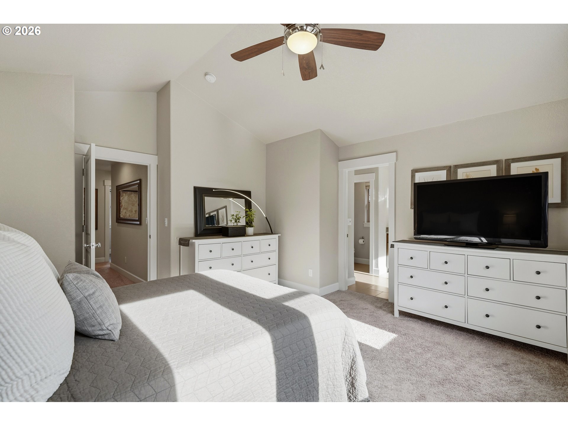 17390 Aubin Street Sandy, OR 97055 - Photo 28 of 41 a bedroom with a bed a flat screen tv and dresser