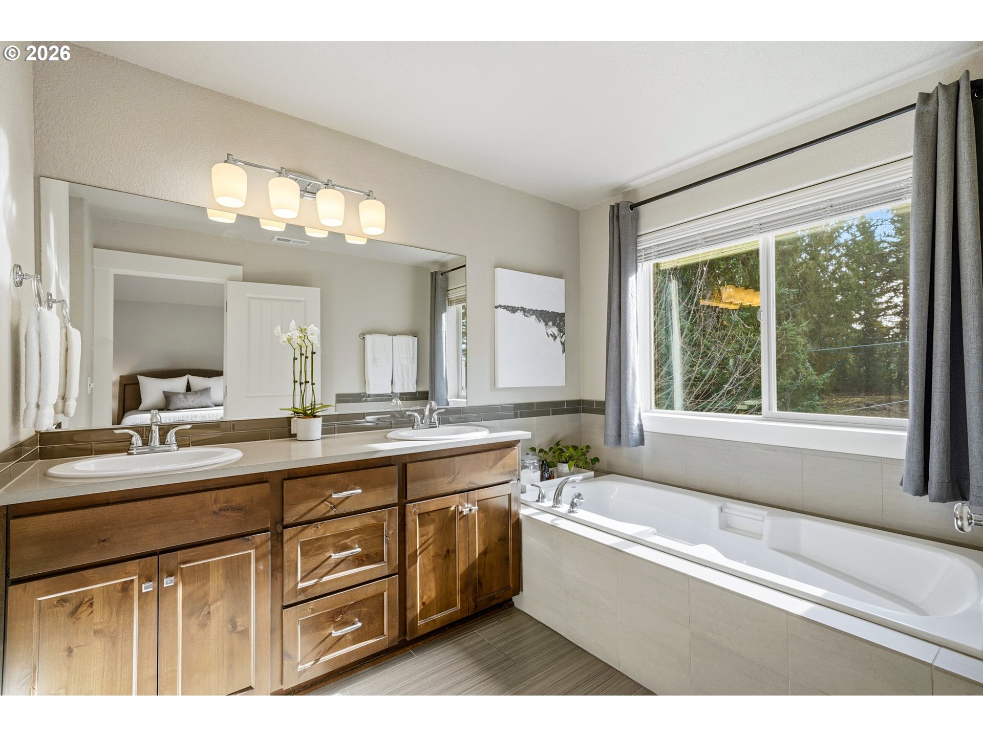 17390 Aubin Street Sandy, OR 97055 - Photo 29 of 41 a bathroom with a granite countertop sink mirror bathtub and window
