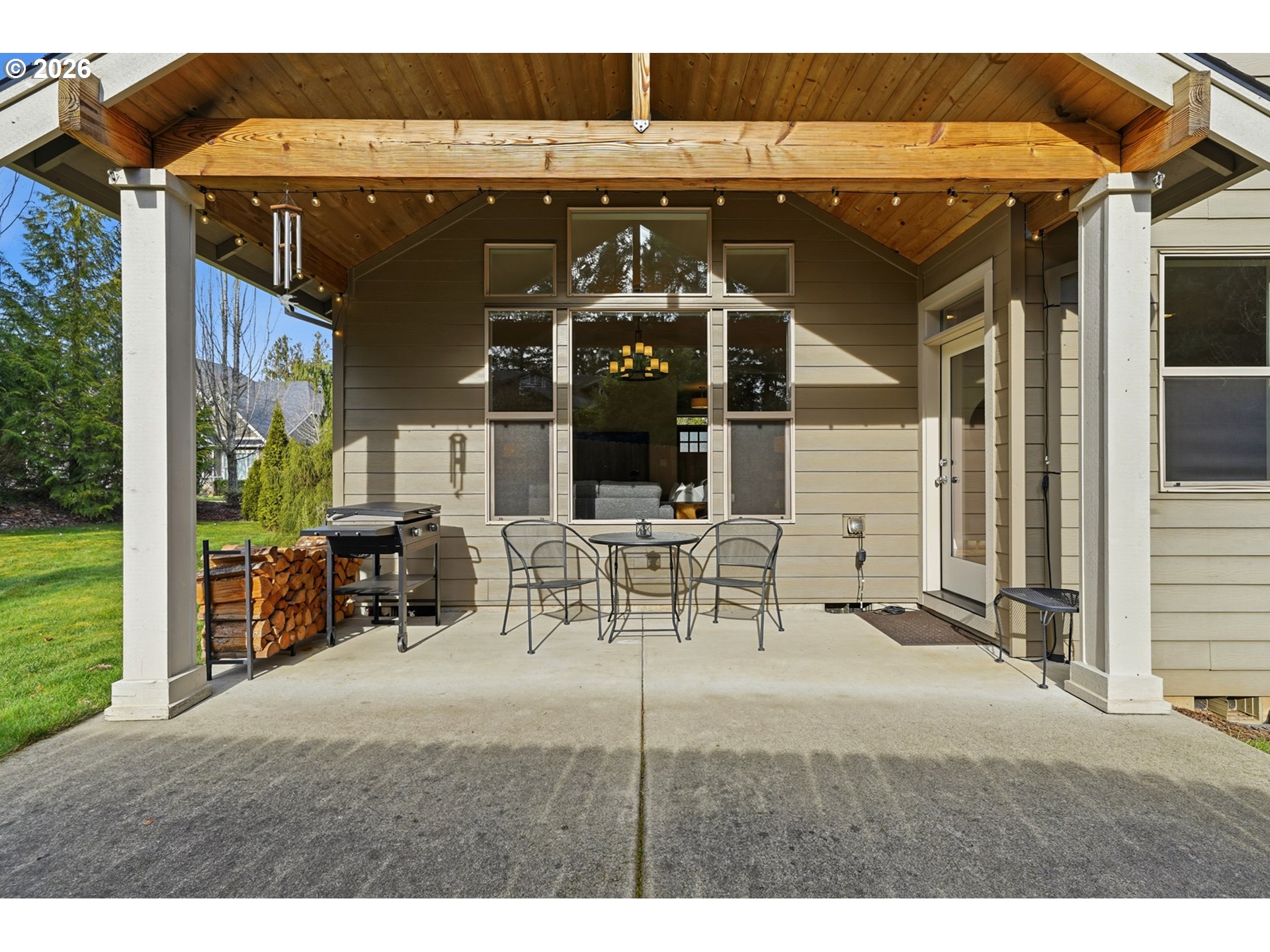17390 Aubin Street Sandy, OR 97055 - Photo 32 of 41 a view of a patio with table and chairs with the view of small yard