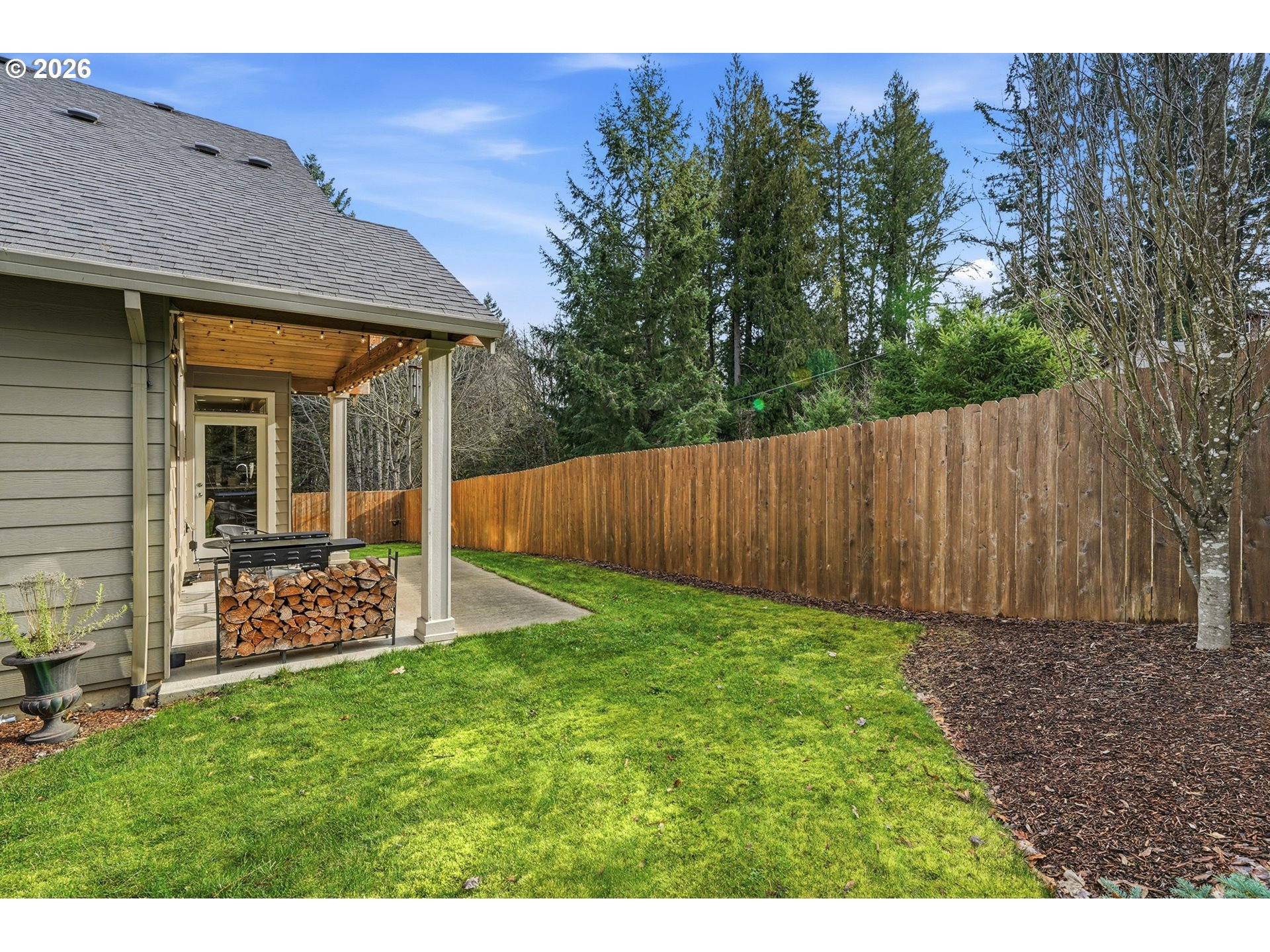 17390 Aubin Street Sandy, OR 97055 - Photo 37 of 41 a view of a backyard with a garden
