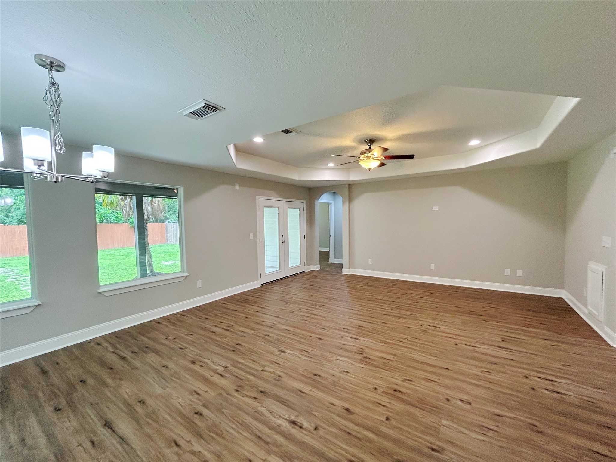 7902 Masters Manvel, TX 77578 - Photo 11 of 21 The den features upgraded features including a raised ceiling, ceiling fan and recessed lighting.