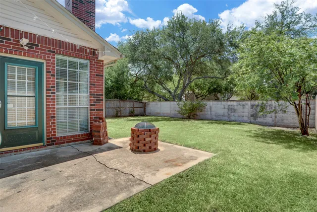 a view of a backyard with a tub