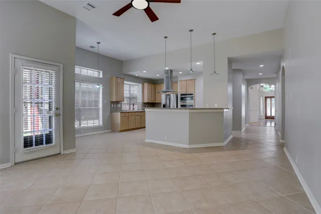 a view of a kitchen with refrigerator and microwave