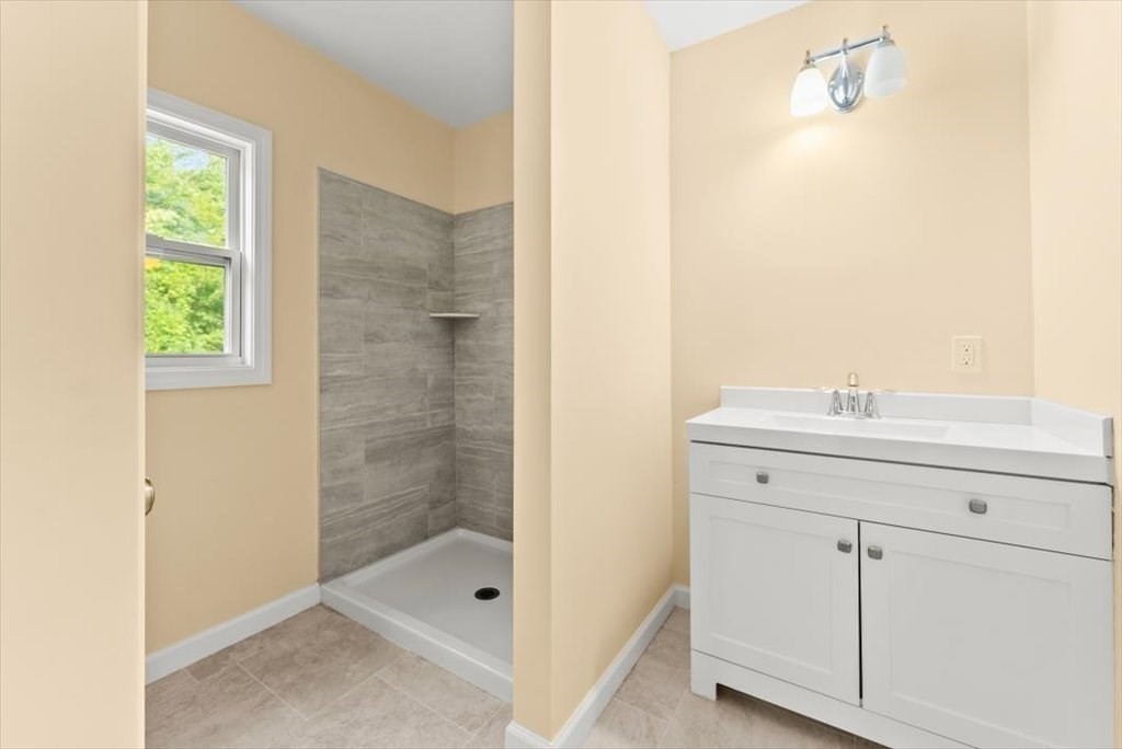 1893 Allen Street Springfield, MA 01128 - Photo 16 of 25 a bathroom with a shower sink and mirror