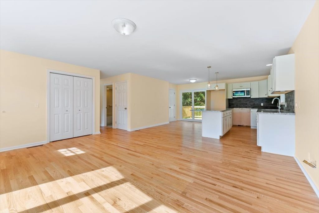 1893 Allen Street Springfield, MA 01128 - Photo 3 of 25 a view of a kitchen with wooden floor and a sink