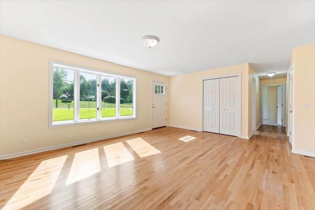 1893 Allen Street Springfield, MA 01128 - Photo 9 of 25 a view of an empty room with wooden floor and a window