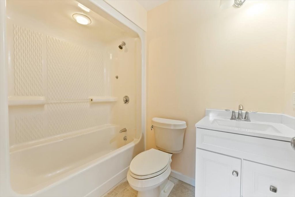 1893 Allen Street Springfield, MA 01128 - Photo 10 of 25 a bathroom with a sink a toilet and a bathtub