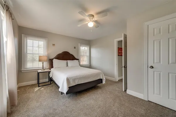 a bedroom with a bed and window