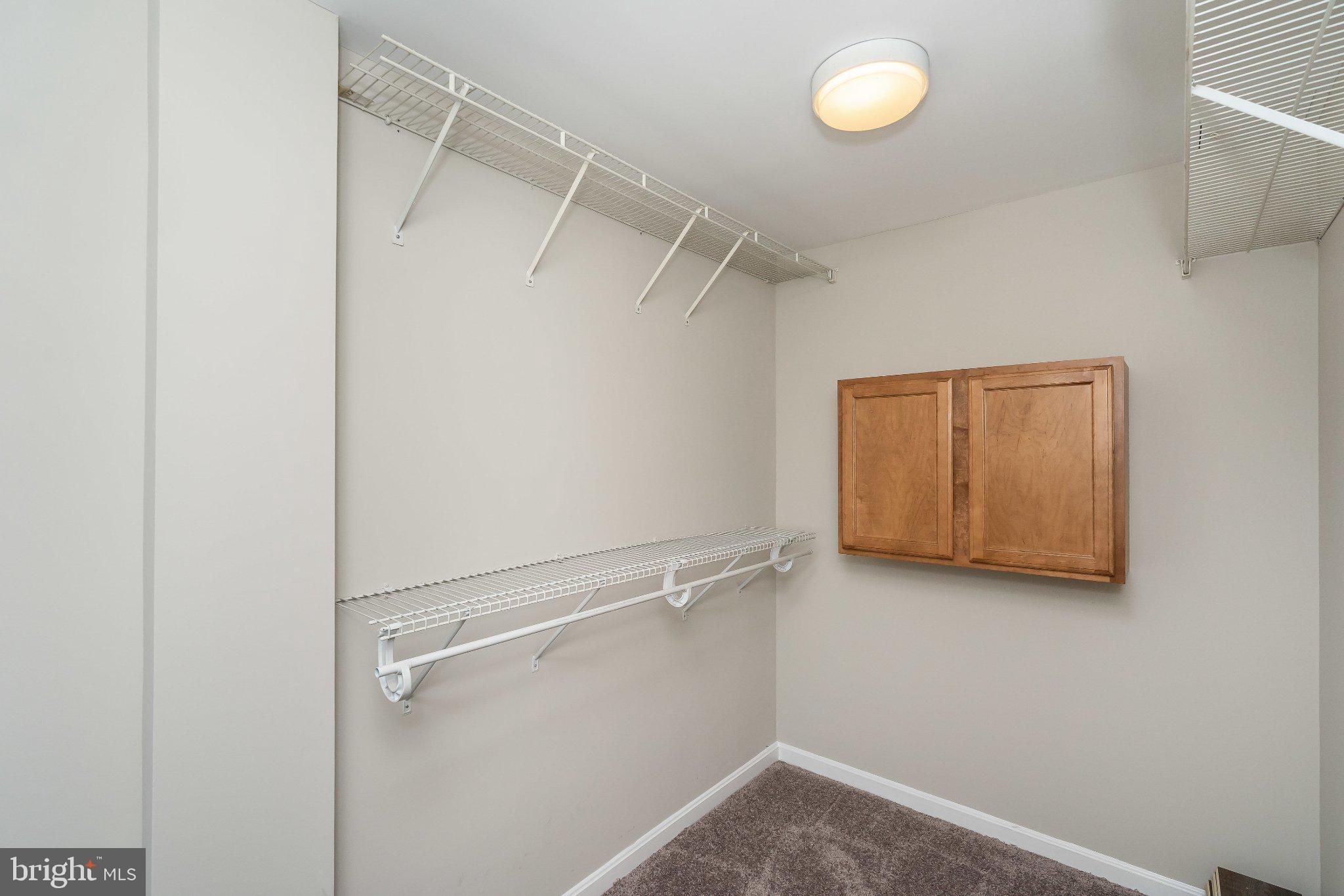 2702 Lighthouse Point East, Unit 532 Baltimore, MD 21224 - Photo 28 of 41 Spacious closet with organized storage.
