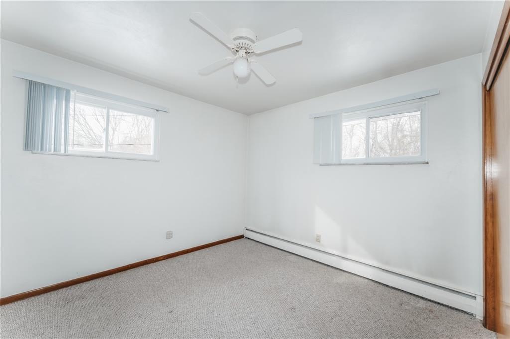 1061 Martin Road Tarentum, PA 15084 - Photo 11 of 25 an empty room with a window and a ceiling fan