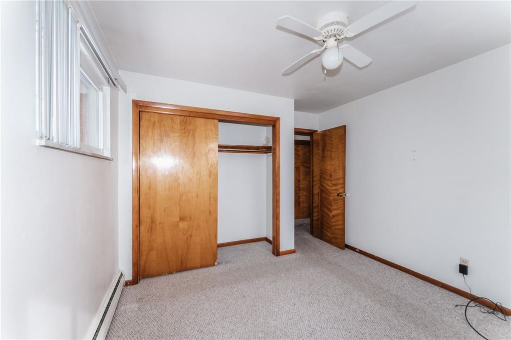 1061 Martin Road Tarentum, PA 15084 - Photo 12 of 25 a view of an empty room with a ceiling fan