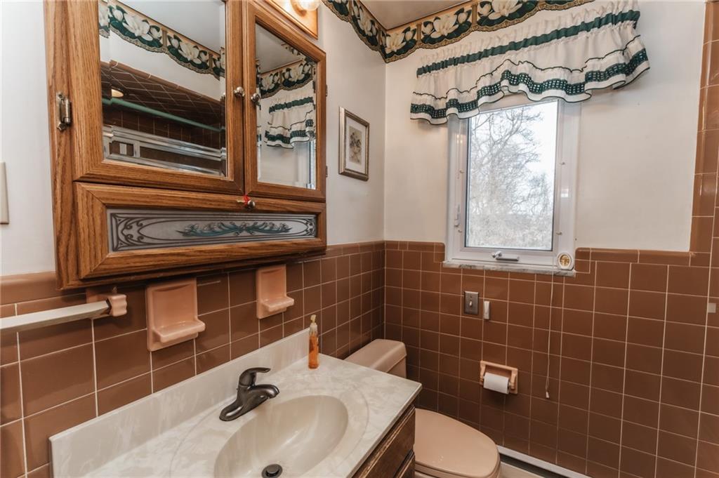 1061 Martin Road Tarentum, PA 15084 - Photo 13 of 25 a bathroom with a sink a toilet and shower