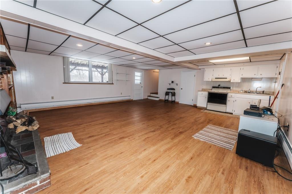 1061 Martin Road Tarentum, PA 15084 - Photo 16 of 25 a view of a livingroom with furniture a ceiling fan and wooden floor