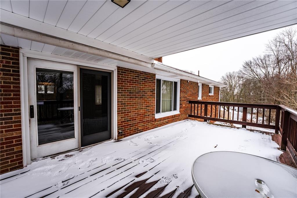 1061 Martin Road Tarentum, PA 15084 - Photo 21 of 25 a view of a balcony with a couple of table and chairs