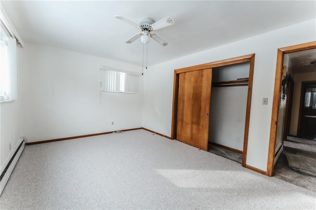 1061 Martin Road Tarentum, PA 15084 - Photo 8 of 25 an empty room with closet and a ceiling fan