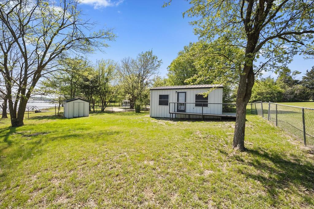 Tbd Waters Edge Quinlan, TX 75474 - Photo 28 of 32 a view of a house with swimming pool next to a yard