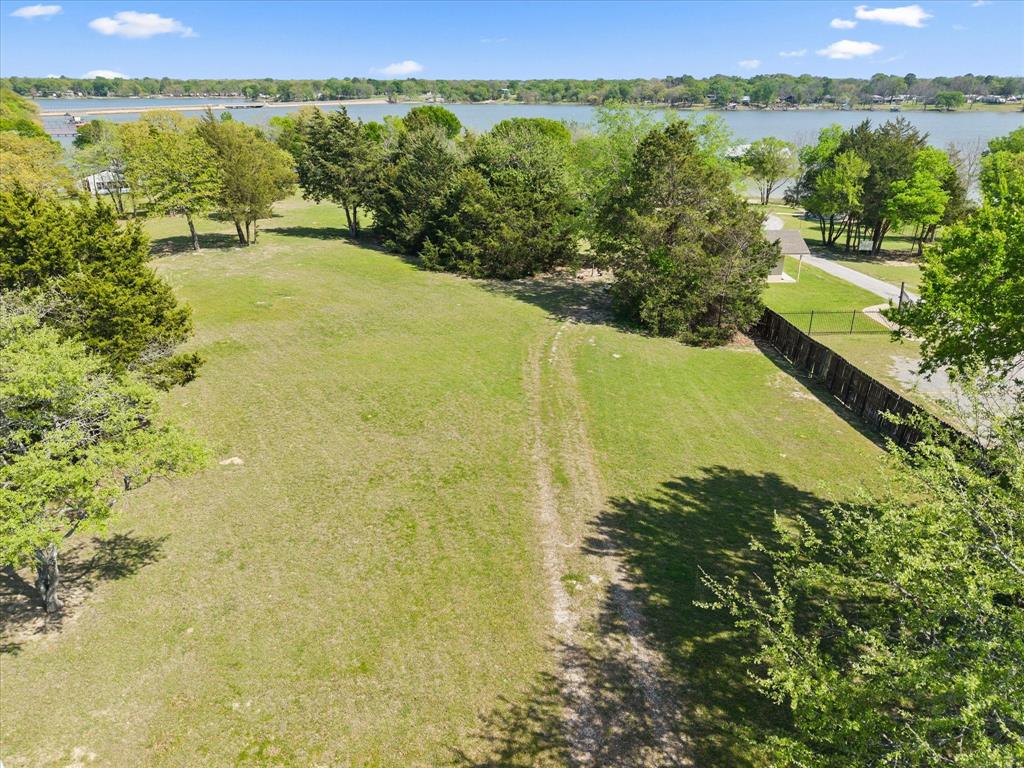 Tbd Waters Edge Quinlan, TX 75474 - Photo 3 of 32 a view of a lake with a yard