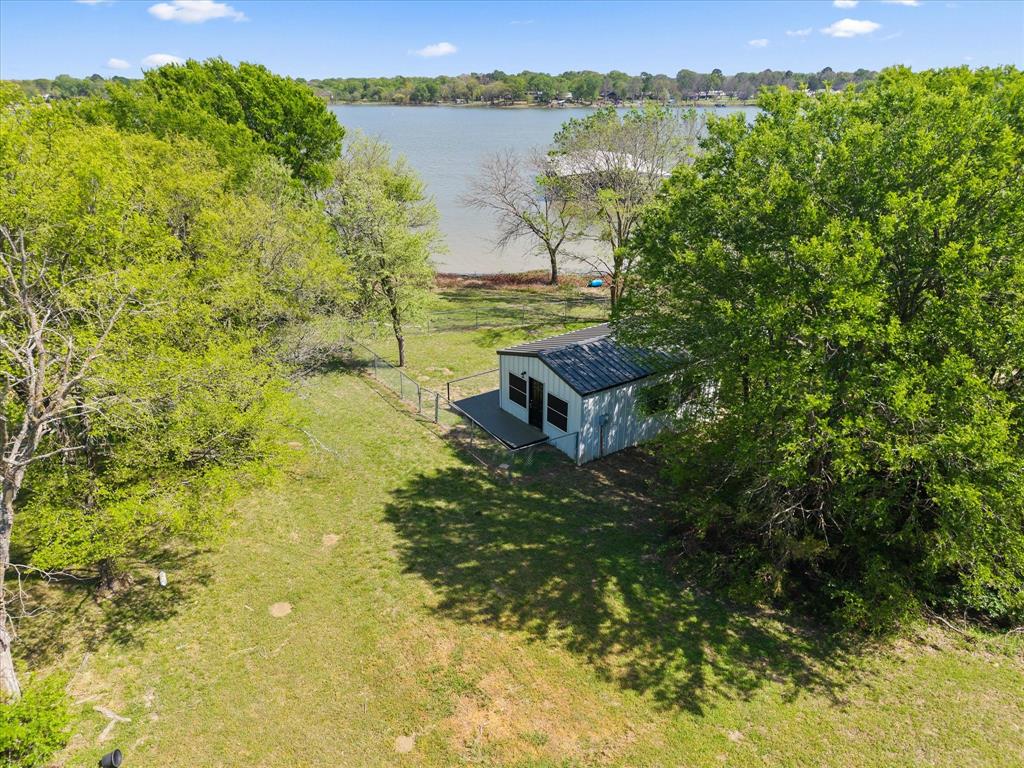 Tbd Waters Edge Quinlan, TX 75474 - Photo 6 of 32 a view of a lake from a yard