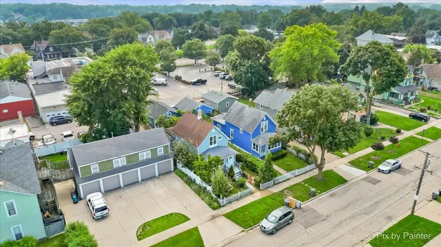 an aerial view of a house with a yard