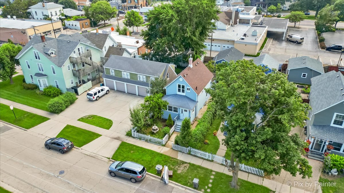 309 Griswold Street Elgin, IL 60123 - Photo 29 of 39 an aerial view of multiple houses with yard