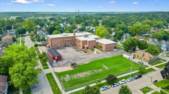 an aerial view of a house with a garden