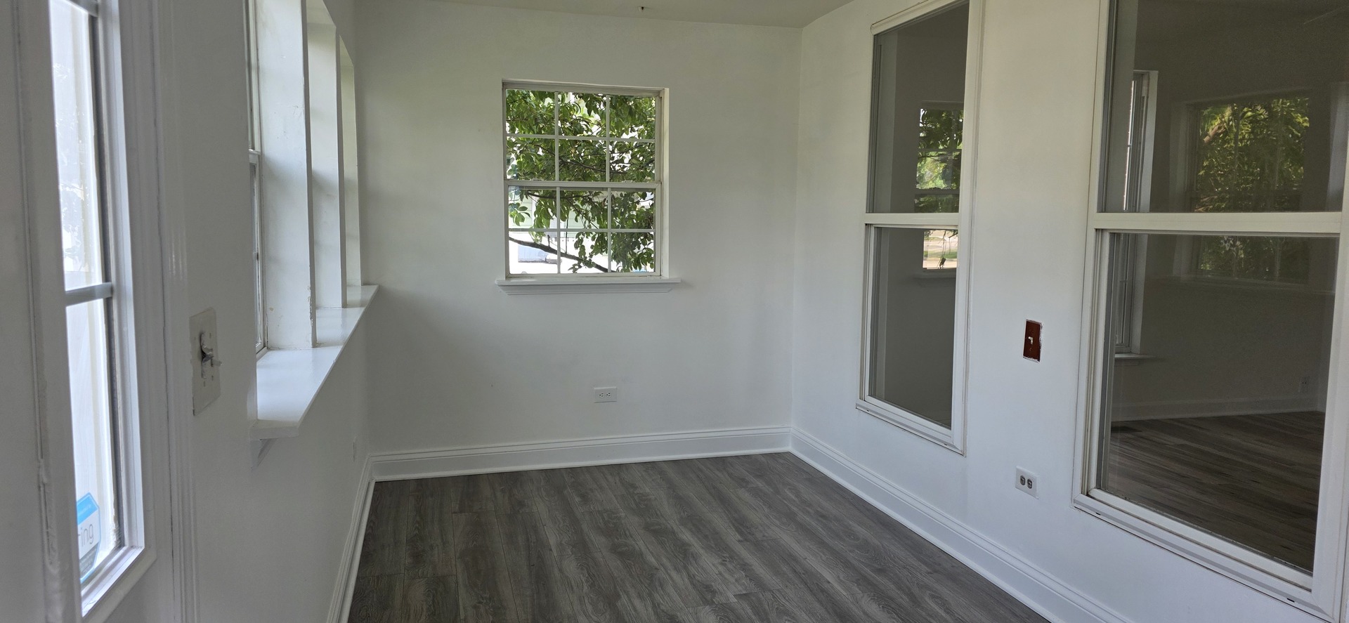 309 Griswold Street Elgin, IL 60123 - Photo 5 of 39 a view of a hallway with wooden floor and entryway
